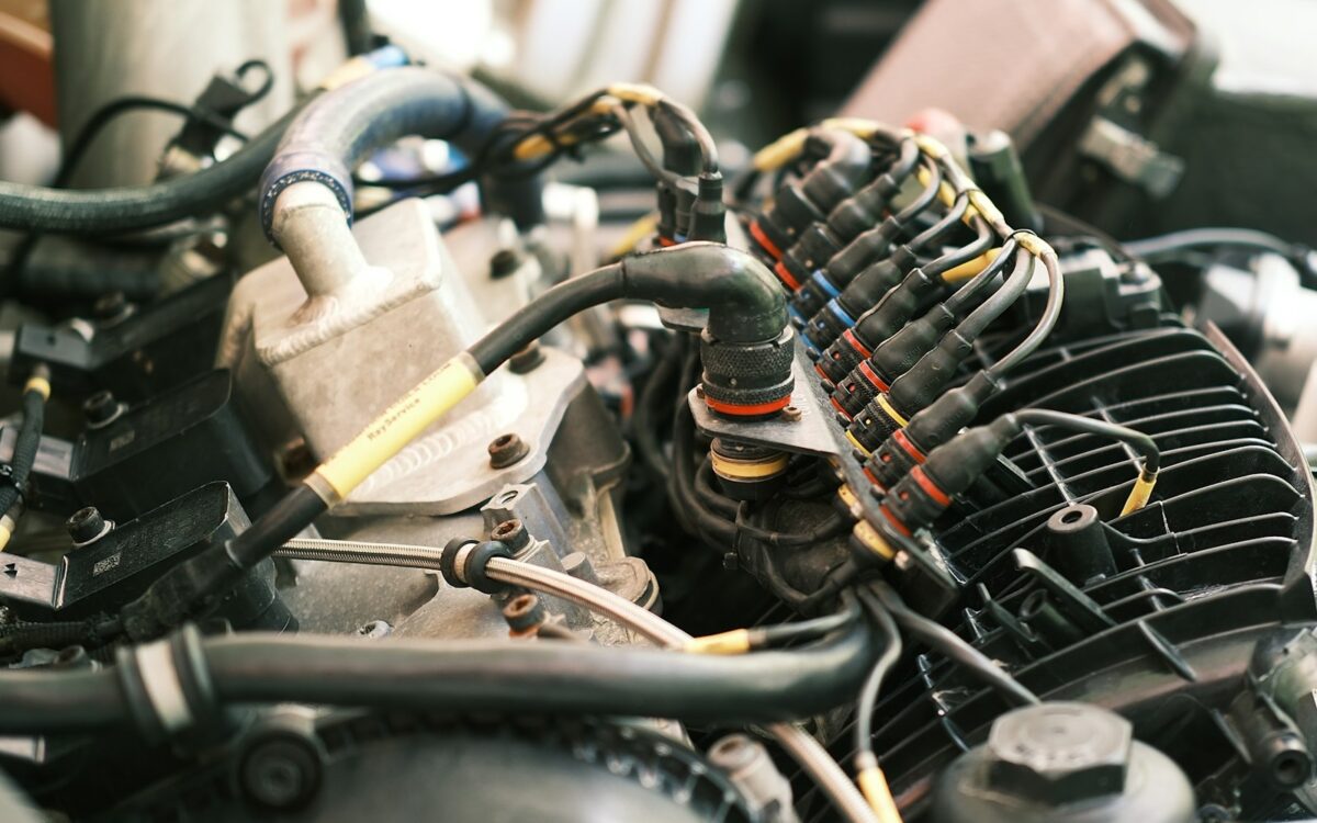 Open engine bay showing wiring and engine components