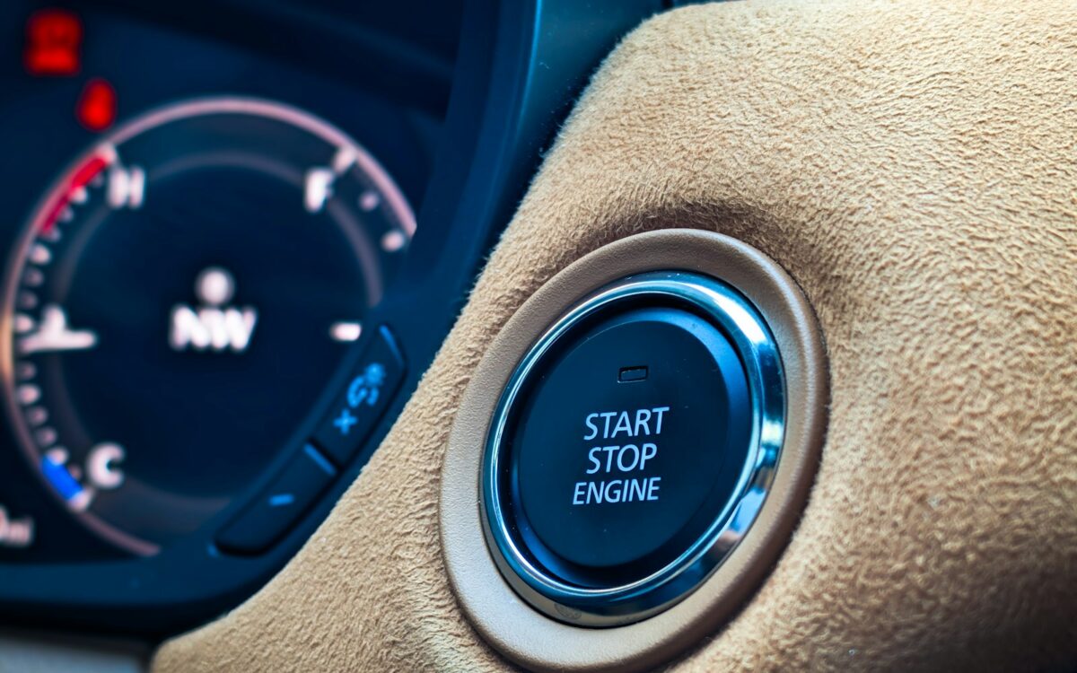 Push-button start on a car dashboard, used to crank the engine through the starter